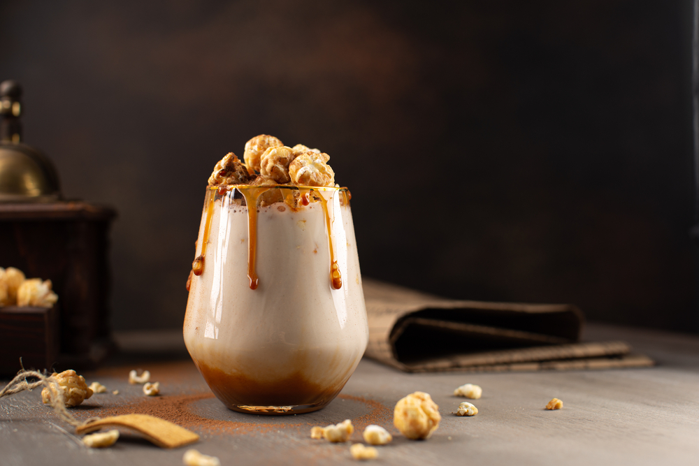 Sweet,Milkshake,With,Caramel,Syrup,cream,Liqueur,caramel,Popcorn,And,Chocolate,Powder