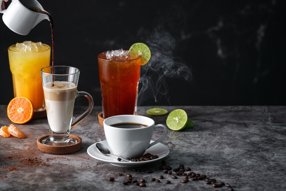 Latte,,Americano,,Orange,Juice,,Lime,Tea,Served,On,Dark,Background.